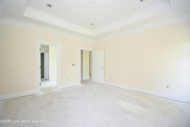 63 Noles Dr, Tallassee, AL 36078 - unfurnished bedroom featuring a tray ceiling and ornamental molding