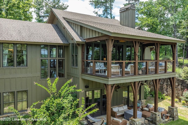 back of property with an outdoor hangout area