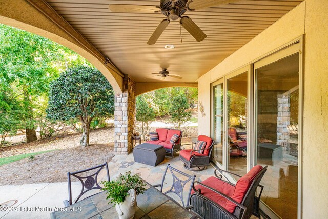 view of patio with outdoor lounge area and ceiling fan