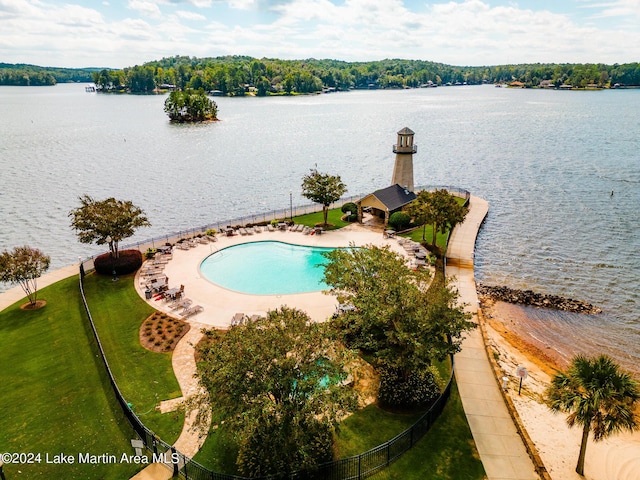 view of pool with a water view