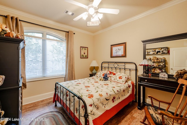 bedroom with wood-type flooring, ceiling fan, and ornamental molding