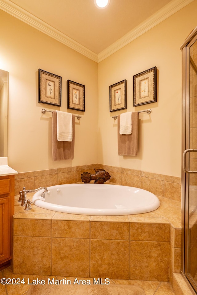 bathroom with tile patterned floors, vanity, shower with separate bathtub, and ornamental molding