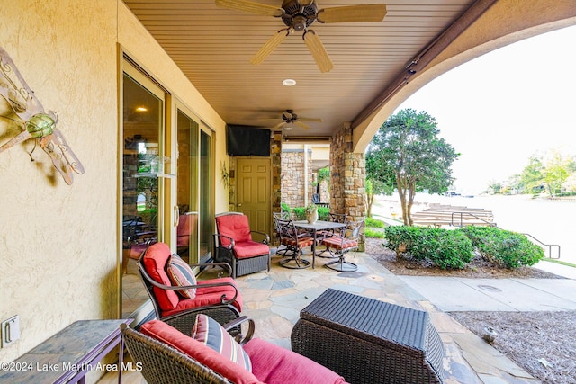 view of patio featuring ceiling fan