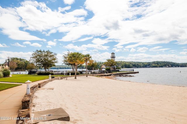 view of property's community featuring a yard and a water view