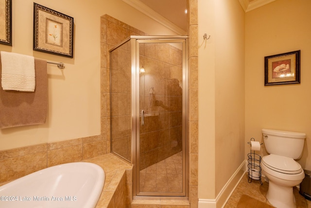 bathroom featuring tile patterned flooring, shower with separate bathtub, toilet, and crown molding