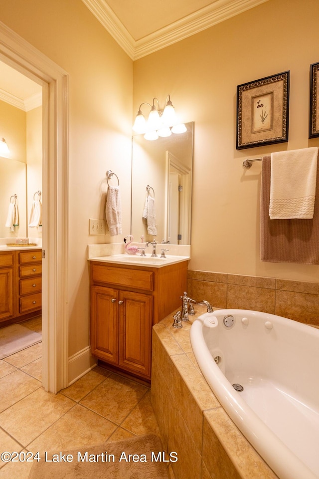 bathroom featuring vanity, tile patterned floors, ornamental molding, and tiled tub