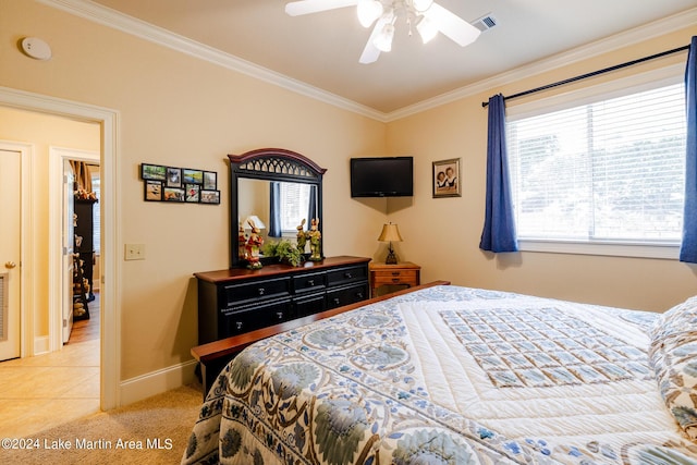 bedroom with multiple windows, light colored carpet, ceiling fan, and ornamental molding