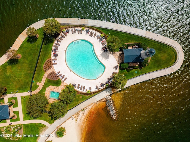 birds eye view of property with a water view