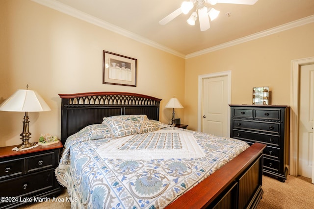 carpeted bedroom featuring ceiling fan and crown molding