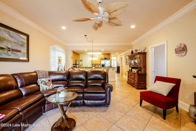 living room with ceiling fan, light tile patterned floors, and ornamental molding