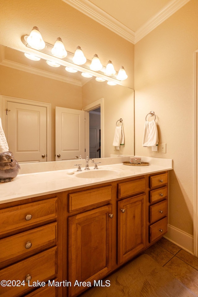 bathroom with vanity and ornamental molding