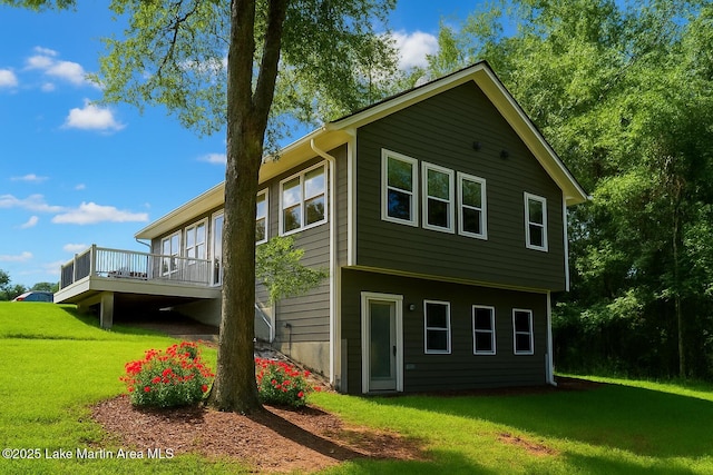 572 Newman Rd, Alexander City, AL 35010 - view of home's exterior featuring a deck and a yard