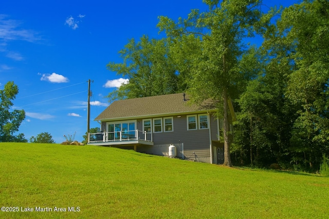 572 Newman Rd, Alexander City, AL 35010 - back of house featuring a lawn and a deck