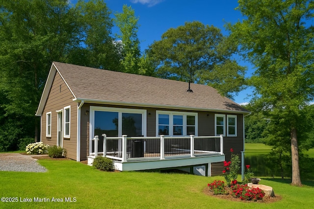 572 Newman Rd, Alexander City, AL 35010 - back of house featuring a yard and roof with shingles