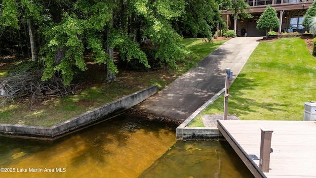 47 Oaks Knl, Jacksons Gap, AL 36861 - dock with a boat ramp, a yard, and a water view
