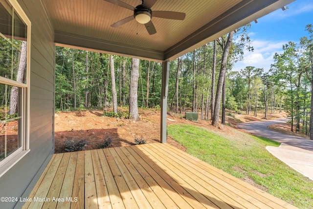 deck with ceiling fan and a lawn