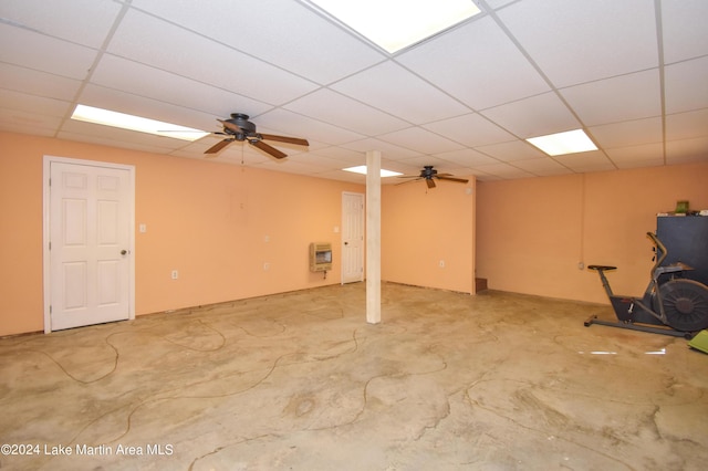 basement with heating unit and a drop ceiling