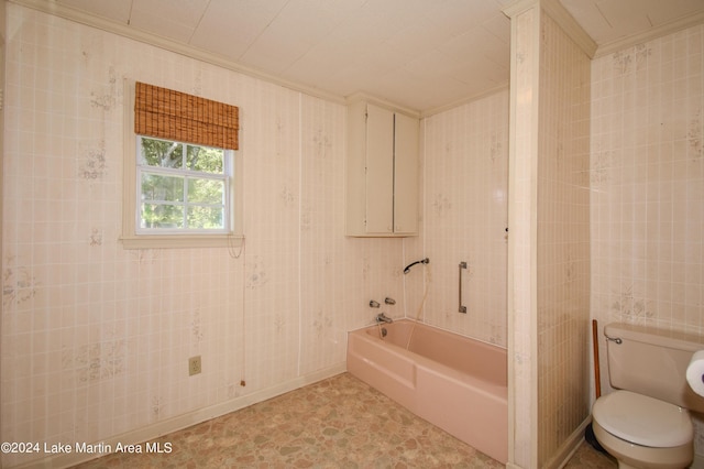 bathroom with ornamental molding, a bath, tile walls, and toilet