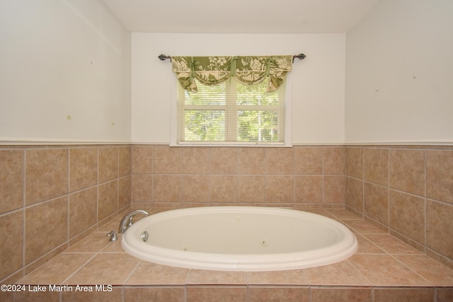 bathroom with tiled bath