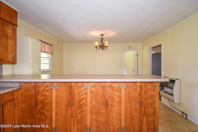 kitchen with a chandelier, pendant lighting, heating unit, and crown molding