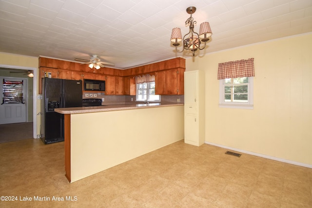 kitchen with black appliances, ceiling fan with notable chandelier, ornamental molding, decorative light fixtures, and kitchen peninsula