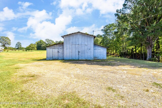 view of outdoor structure with a lawn