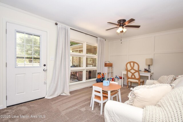 514 Sleepy Holw, Alexander City, AL 35010 - sitting room with a ceiling fan, carpet floors, a decorative wall, and crown molding