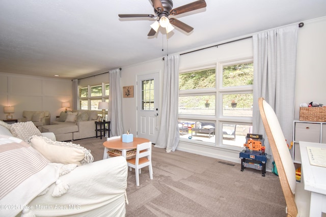 514 Sleepy Holw, Alexander City, AL 35010 - living room featuring ceiling fan, carpet flooring, and crown molding