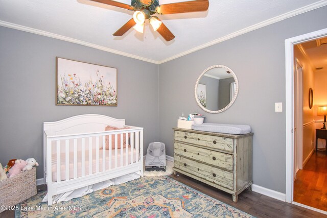 514 Sleepy Holw, Alexander City, AL 35010 - bedroom featuring wood finished floors, crown molding, attic access, a crib, and a ceiling fan