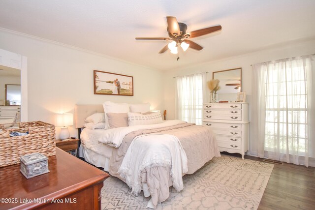 514 Sleepy Holw, Alexander City, AL 35010 - bedroom with crown molding, wood finished floors, and a ceiling fan
