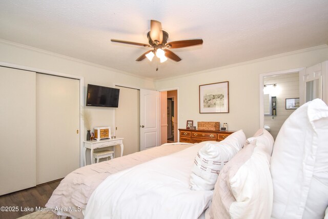 514 Sleepy Holw, Alexander City, AL 35010 - bedroom featuring two closets, crown molding, dark wood-type flooring, ensuite bathroom, and a ceiling fan