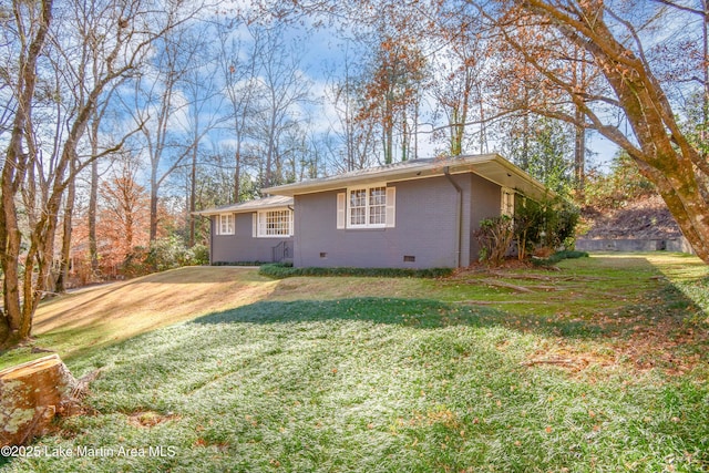 view of home's exterior featuring a yard