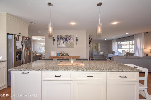 kitchen with white cabinets and light stone counters