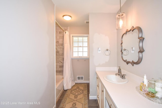 bathroom featuring tile patterned flooring, shower / bath combination with curtain, and vanity