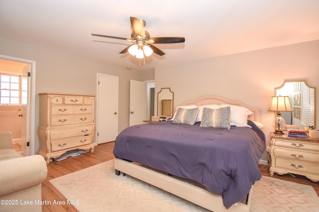 bedroom with light wood-type flooring and ceiling fan