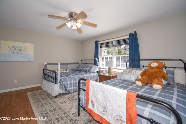 bedroom with hardwood / wood-style floors and ceiling fan