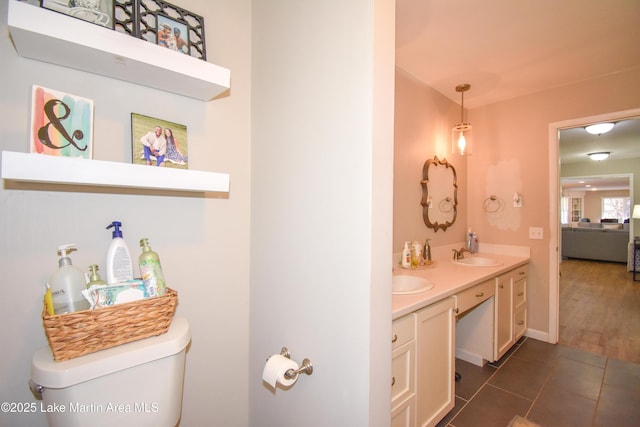 bathroom with tile patterned floors, vanity, and toilet