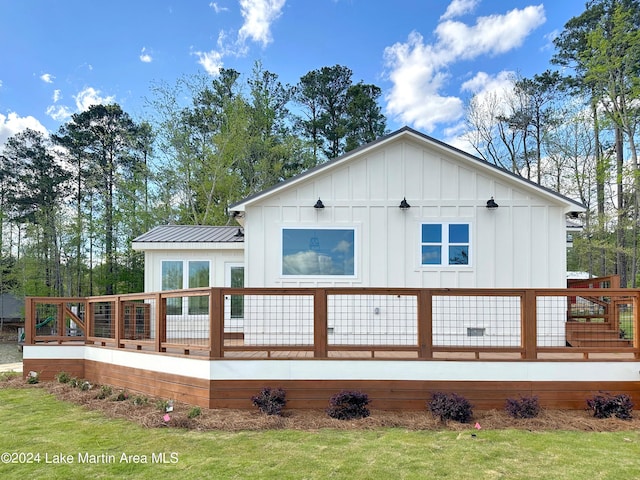 back of property featuring a deck