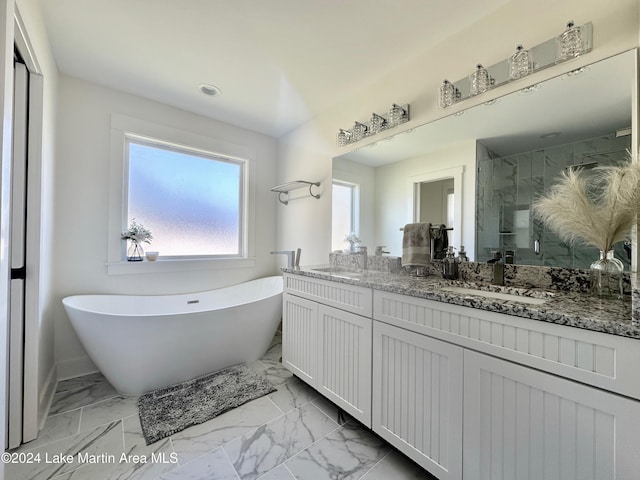 bathroom with vanity and separate shower and tub