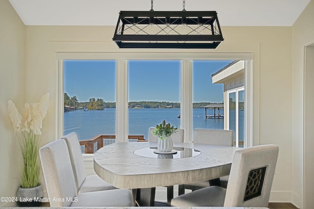 dining room featuring a water view