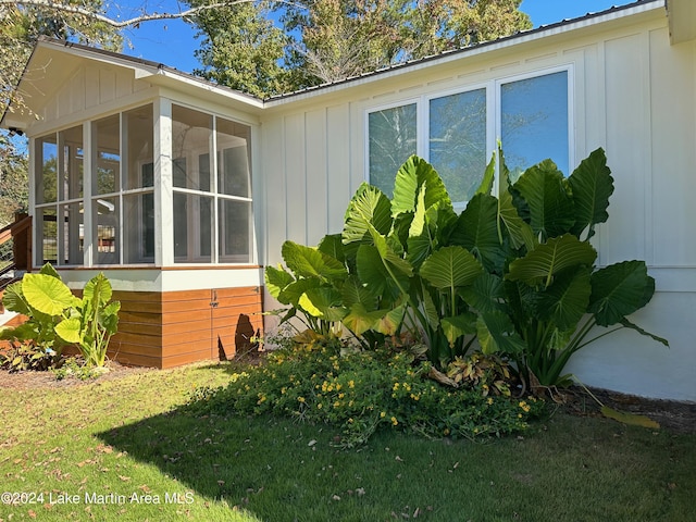 view of side of property with a sunroom