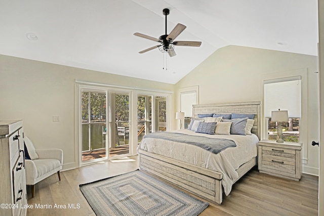 bedroom featuring ceiling fan, light hardwood / wood-style floors, access to exterior, and vaulted ceiling