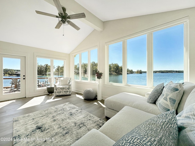 sunroom / solarium with vaulted ceiling with beams, ceiling fan, and a water view