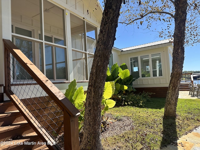 view of side of property with a sunroom