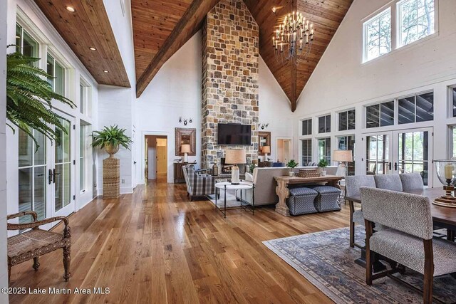 326 Bulgers Mill Loop, Alexander City, AL 35010 - living room featuring high vaulted ceiling, a chandelier, wood-type flooring, french doors, and wood ceiling