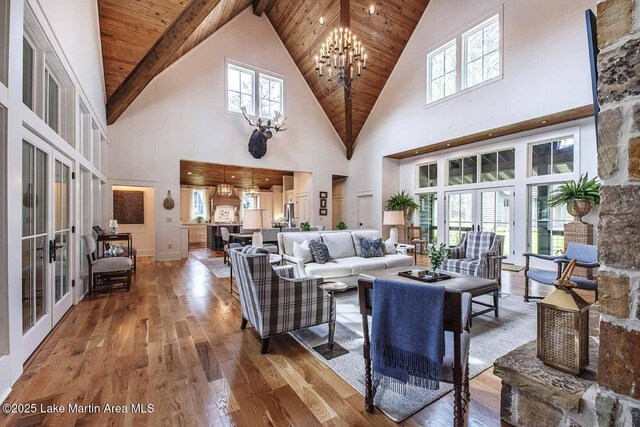 326 Bulgers Mill Loop, Alexander City, AL 35010 - living area with french doors, wood-type flooring, wooden ceiling, high vaulted ceiling, and a chandelier