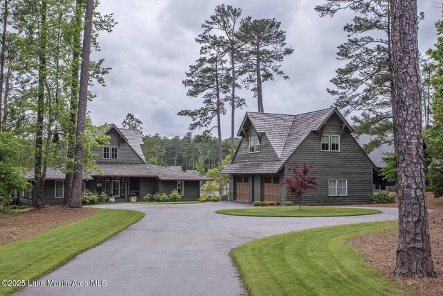 326 Bulgers Mill Loop, Alexander City, AL 35010 - view of front of home with asphalt driveway, a front lawn, and a garage