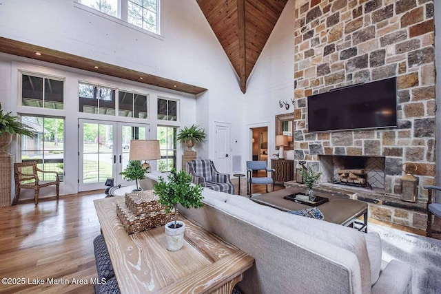 326 Bulgers Mill Loop, Alexander City, AL 35010 - living room with high vaulted ceiling, a fireplace, wood finished floors, french doors, and wood ceiling