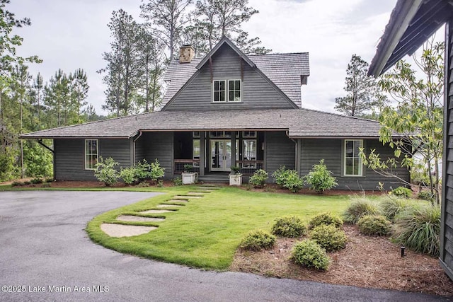 326 Bulgers Mill Loop, Alexander City, AL 35010 - country-style home with a front lawn, a chimney, and a porch