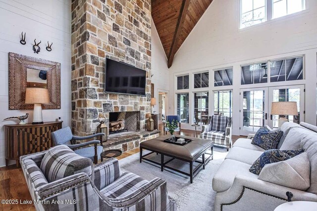 326 Bulgers Mill Loop, Alexander City, AL 35010 - living room with wood finished floors, high vaulted ceiling, wooden ceiling, and a fireplace
